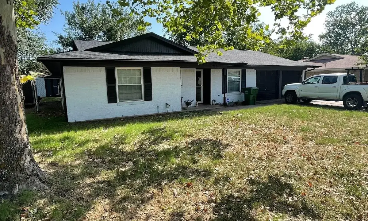Professional roofing crew working on a residential roof in Fairlawn